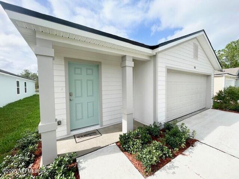 Exterior details and patio area of a home in Grand Reserve, Bunnell (Image 36).