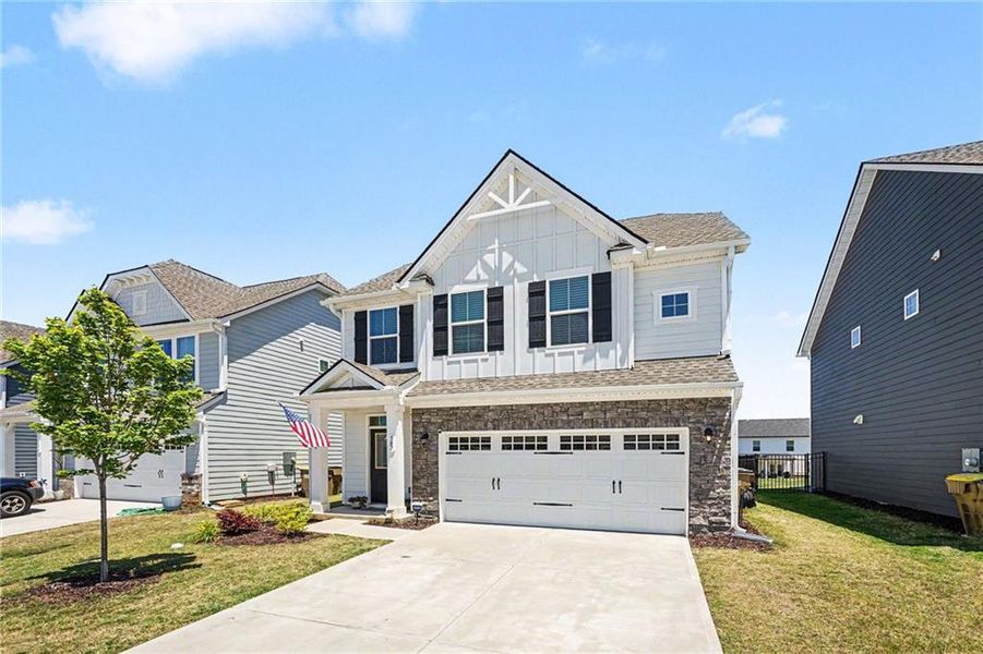 Front exterior of a new home in , Hoschton, GA, highlighting curb appeal (Image 26). Front exterior of a new home in , Hoschton, GA, highlighting curb appeal (Image 26).