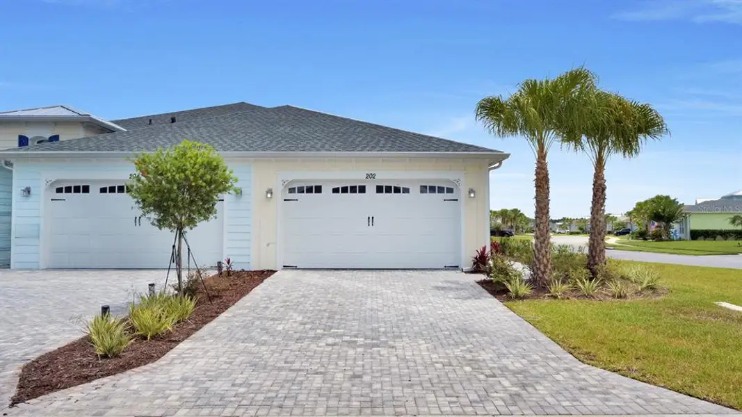 Front exterior of a new home in , Daytona Beach, FL, highlighting curb appeal (Image 1). Front exterior of a new home in , Daytona Beach, FL, highlighting curb appeal (Image 1).