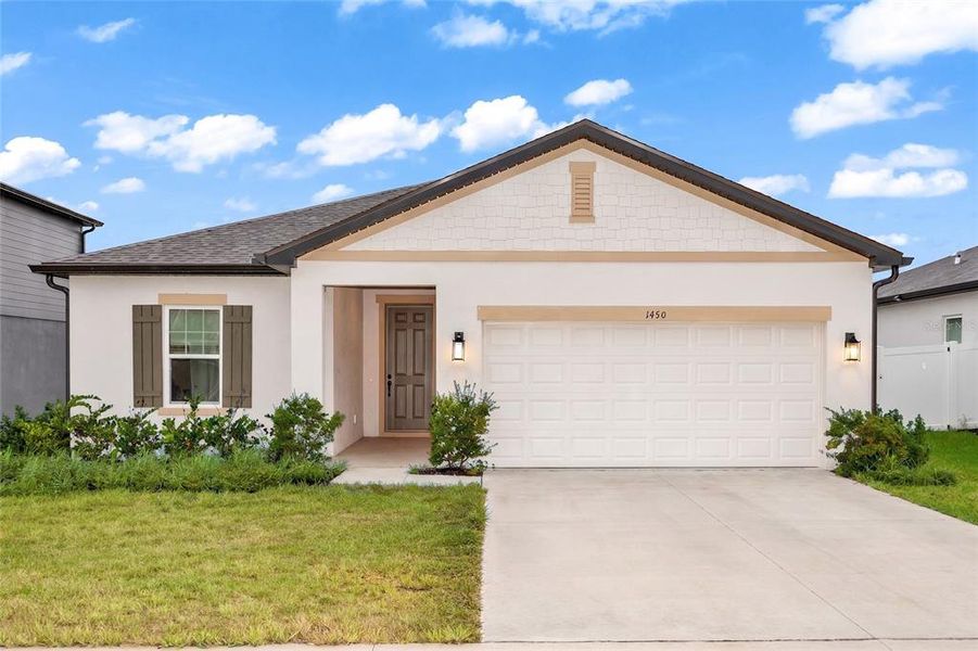 Front exterior of a new home in Hampton Oaks Traditional, Deltona, FL, highlighting curb appeal (Image 2). Front exterior of a new home in Hampton Oaks Traditional, Deltona, FL, highlighting curb appeal (Image 2).