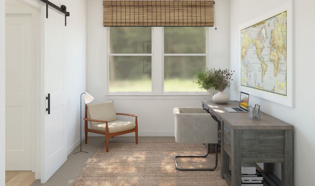 Private home office with double barn doors off foyer