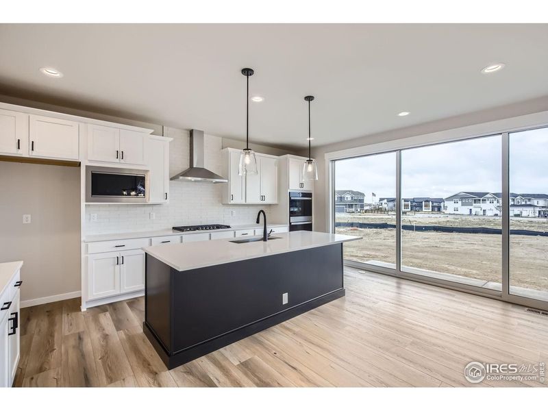 Furnished interior view inside a new home in RainDance, Windsor (Image 9).