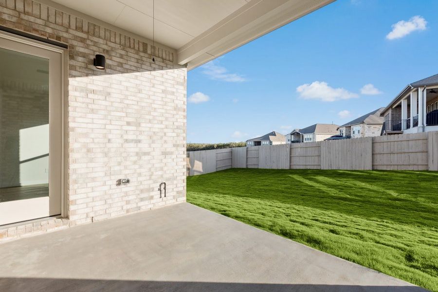 Exterior details and patio area of a home in The Colony, Bastrop (Image 4).