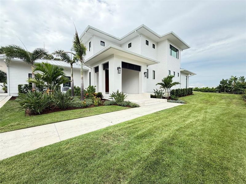 Front exterior of a new home in , New Smyrna Beach, FL, highlighting curb appeal (Image 1). Front exterior of a new home in , New Smyrna Beach, FL, highlighting curb appeal (Image 1).