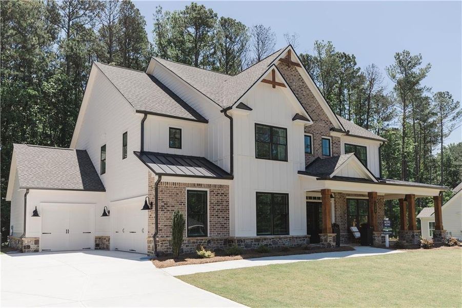Front exterior of a new home in Ford Landing, Acworth, GA, highlighting curb appeal (Image 1).