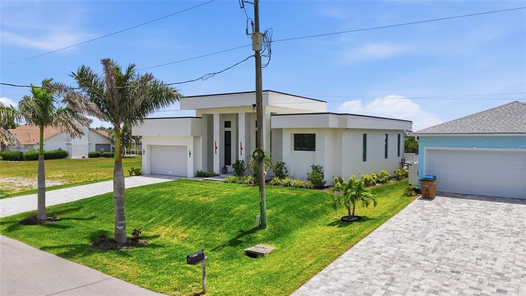 Front exterior of a new home in , Cape Coral, FL, highlighting curb appeal (Image 25).