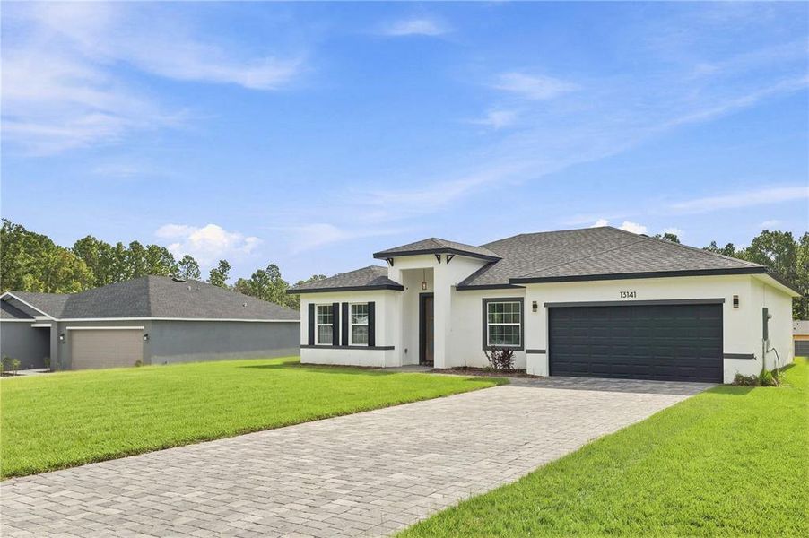 Front exterior of a new home in , Ocala, FL, highlighting curb appeal (Image 23).