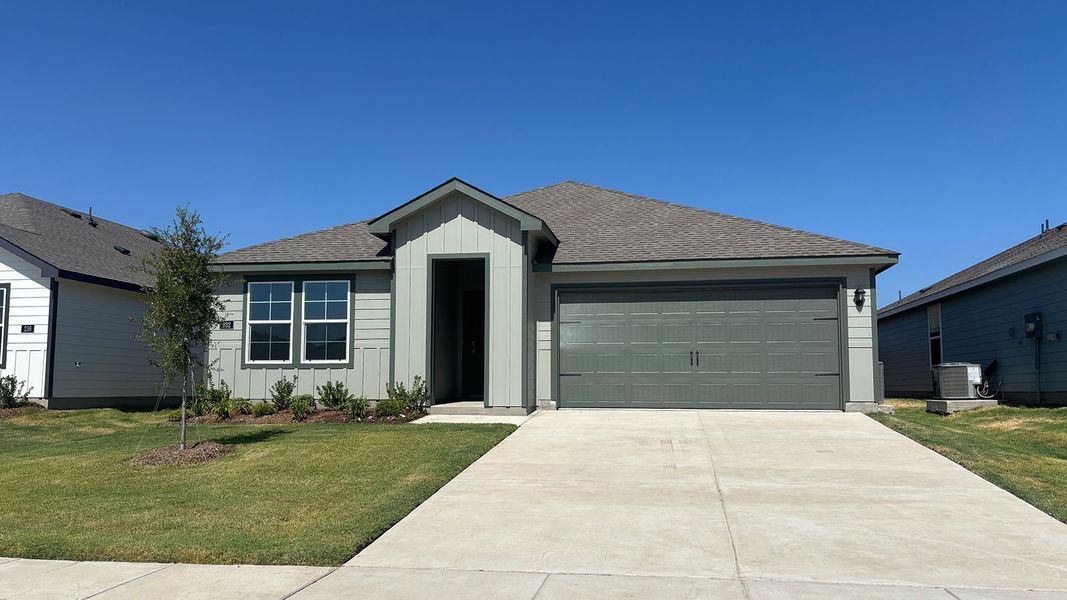 Front exterior of a new home in Wildwood, Royse City, TX, highlighting curb appeal (Image 1). Front exterior of a new home in Wildwood, Royse City, TX, highlighting curb appeal (Image 1).