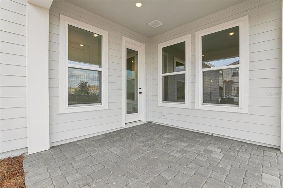 Exterior details and patio area of a home in Weslyn Park Single Family, St. Cloud (Image 24).