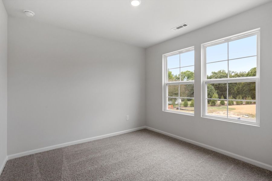 Spacious, unfurnished interior of a new home in Cambridge Reserve, Angier (Image 24).