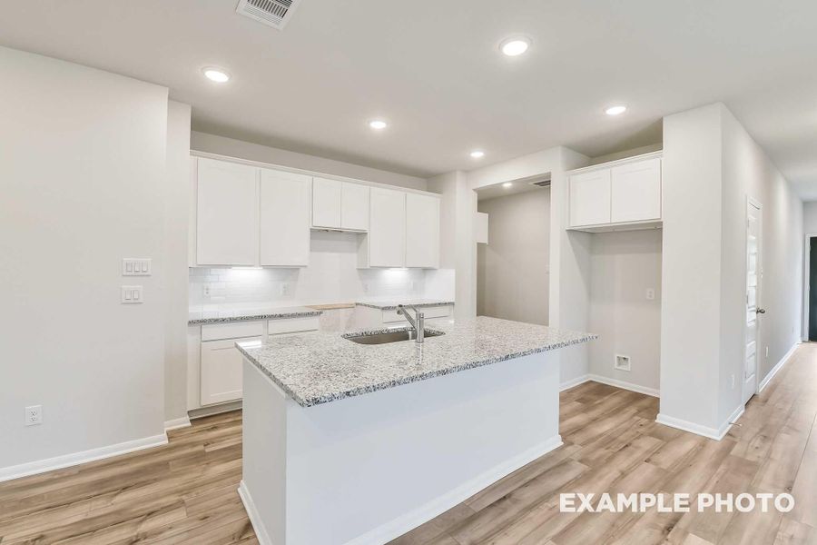 Furnished interior view inside a new home in Caney Creek Place, Conroe (Image 7).