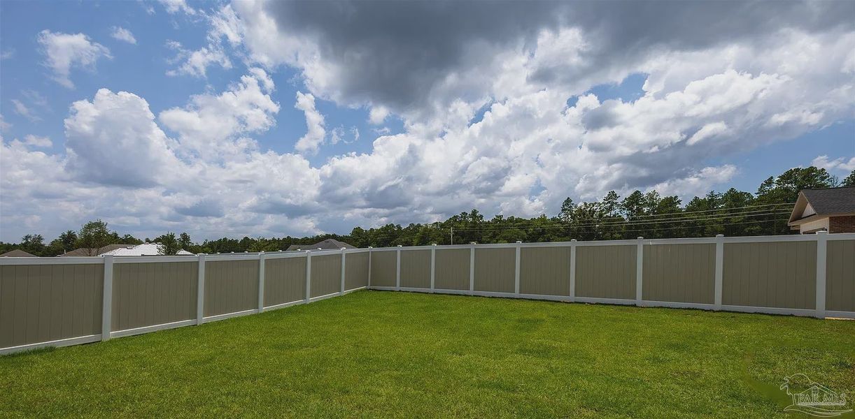 Exterior details and patio area of a home in Parkland Place, Pace (Image 17).