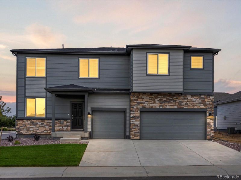 Front exterior of a new home in Poudre Heights: The Alpine Collection, Windsor, CO, highlighting curb appeal (Image 2).