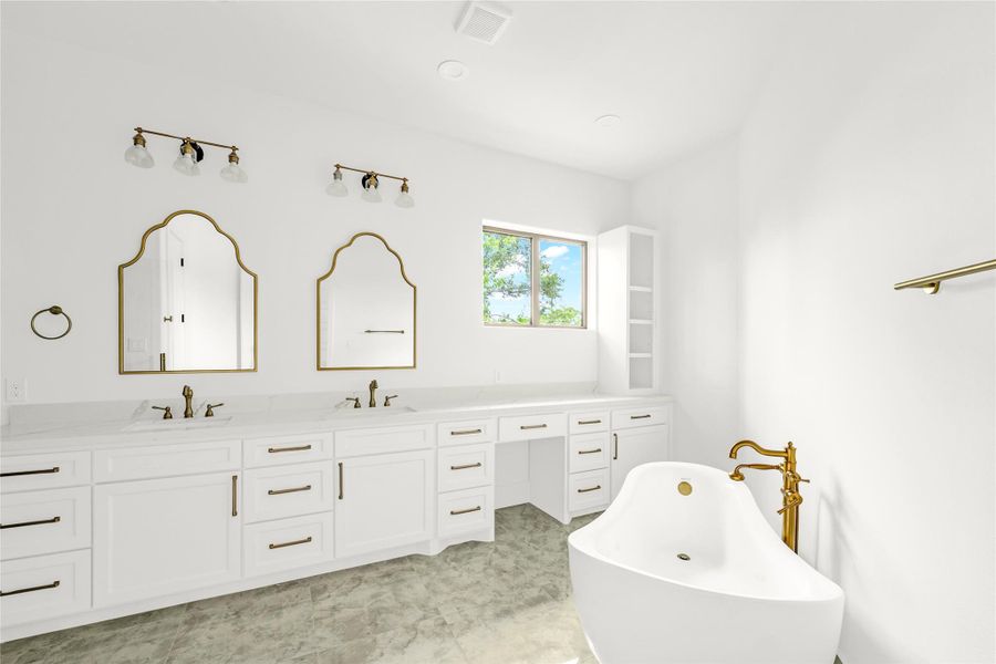 The owner’s bath features arched mirrors, a makeup vanity, and a vintage tub that add timeless character.