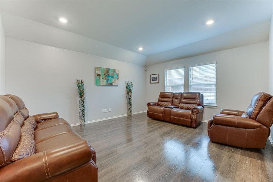 Living room with hardwood / wood-style flooring