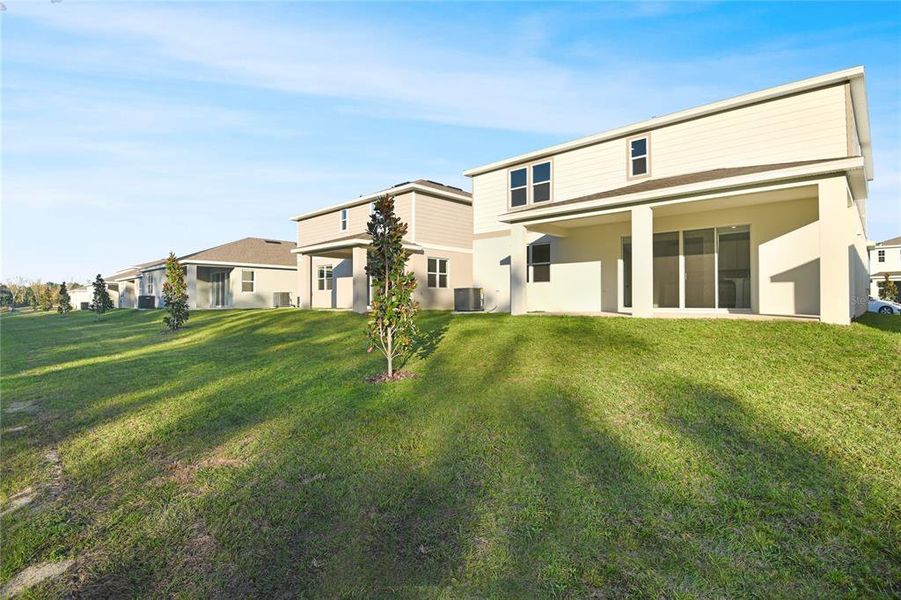 Exterior details and patio area of a home in Seasons at Aurora Oaks, Ocala (Image 17).