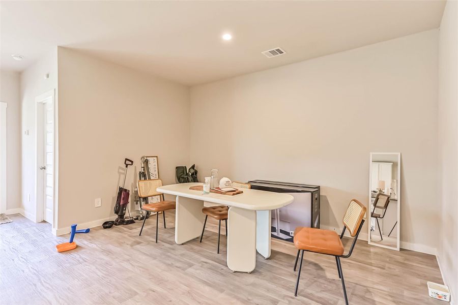 Cozy dining space adjacent to the kitchen with views to the backyard—great for family meals and gatherings.
