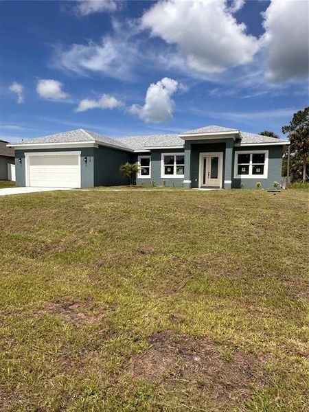 Front exterior of a new home in , Palm Bay, FL, highlighting curb appeal (Image 32). Front exterior of a new home in , Palm Bay, FL, highlighting curb appeal (Image 32).