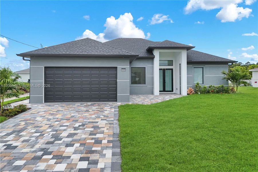Front exterior of a new home in , Lehigh Acres, FL, highlighting curb appeal (Image 20).