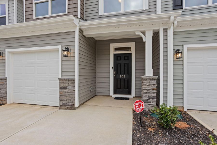 Exterior details and patio area of a home in East Main Townes, Spartanburg (Image 3). Exterior details and patio area of a home in East Main Townes, Spartanburg (Image 3).