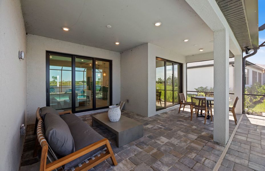 Exterior details and patio area of a home in Arbor Oaks, North Port (Image 4).