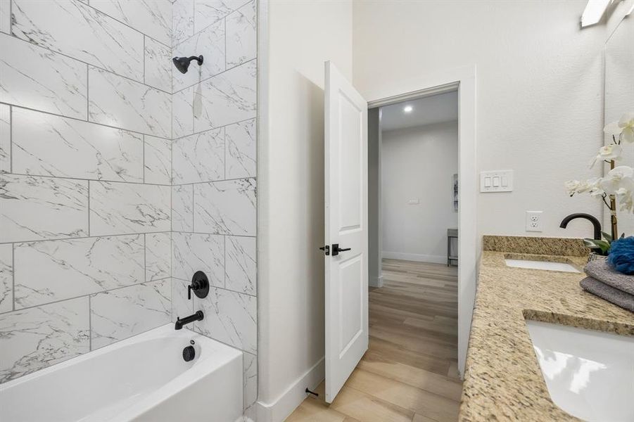 Looking out of the bathroom with a better view of the tub-shower combo