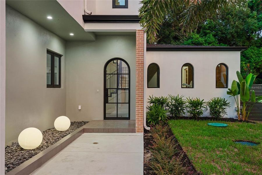 Front exterior of a new home in , Orlando, FL, highlighting curb appeal (Image 24).
