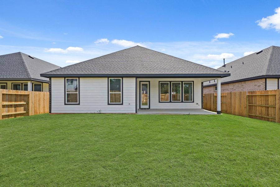 Exterior details and patio area of a home in Hills of Westlake, Conroe (Image 4). Exterior details and patio area of a home in Hills of Westlake, Conroe (Image 4).