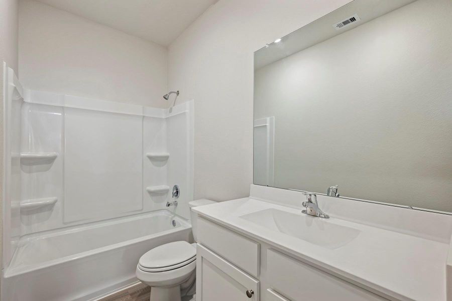 Furnished interior view inside a new home in Canterra Creek, Iowa Colony (Image 3).