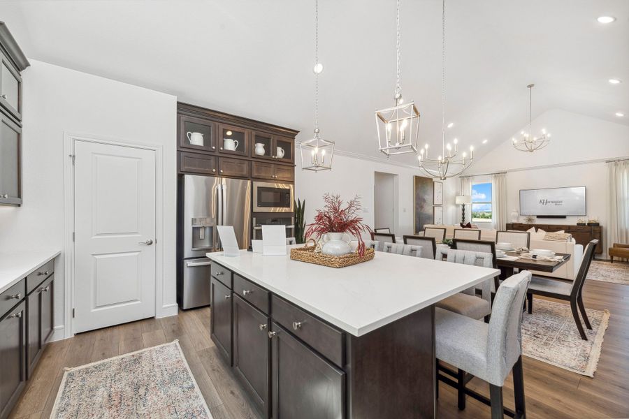 Kitchen with vaulted ceiling overlooking dining area Kitchen with vaulted ceiling overlooking dining area