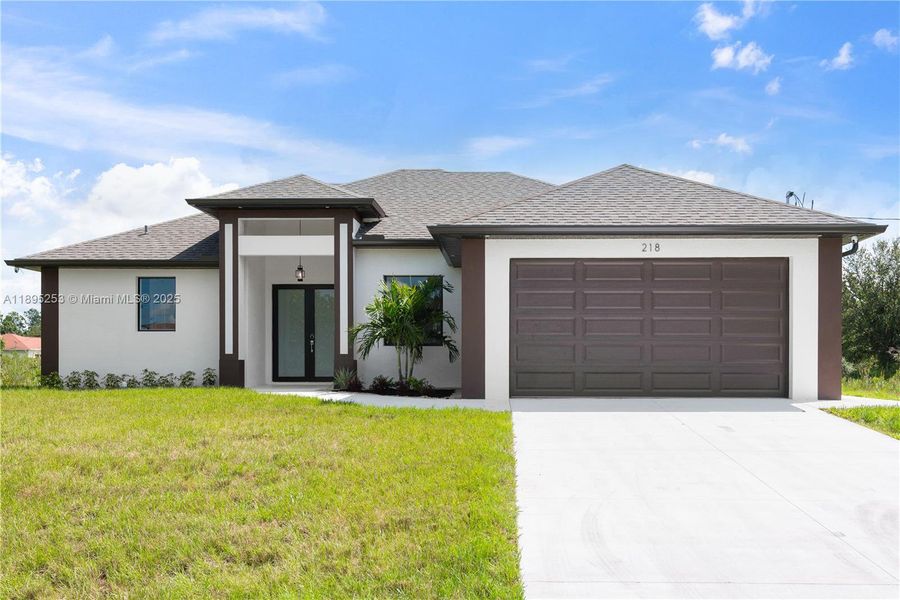 Front exterior of a new home in , Lehigh Acres, FL, highlighting curb appeal (Image 1). Front exterior of a new home in , Lehigh Acres, FL, highlighting curb appeal (Image 1).