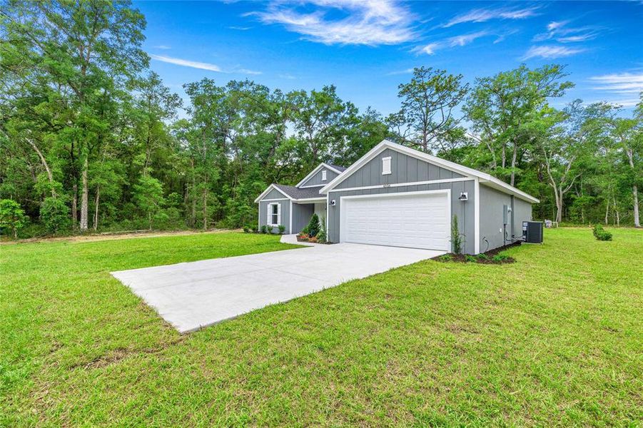 Front exterior of a new home in , Ocala, FL, highlighting curb appeal (Image 17).