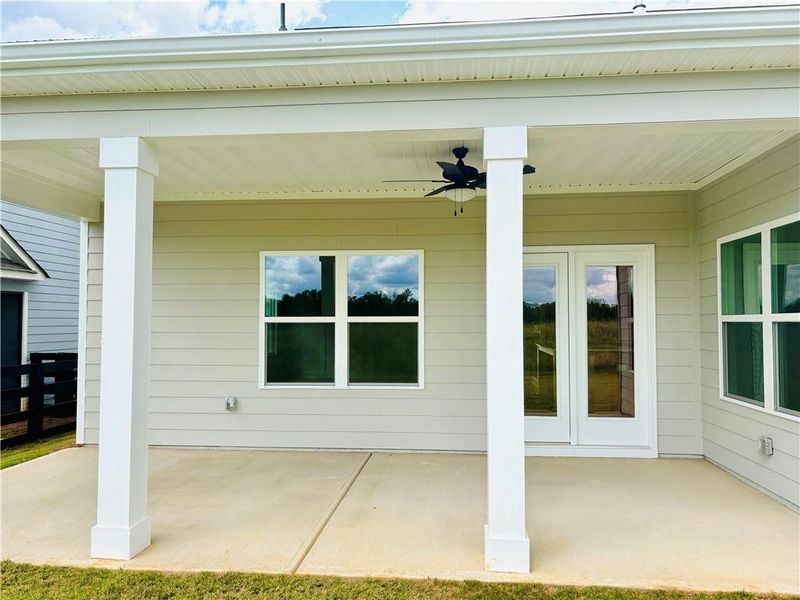 Exterior details and patio area of a home in Heritage Pointe at The Georgian, Villa Rica (Image 3).
