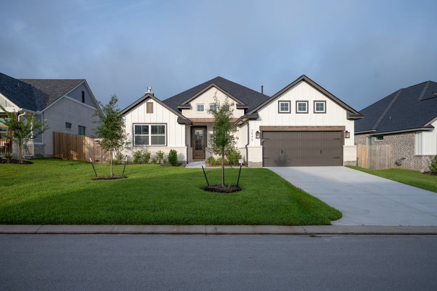 Front exterior of a new home in Greenbrier, Bryan, TX, highlighting curb appeal (Image 1).