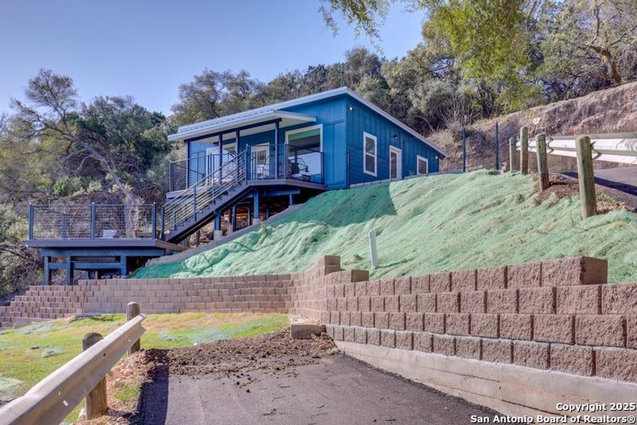 Front exterior of a new home in , Canyon Lake, TX, highlighting curb appeal (Image 2).