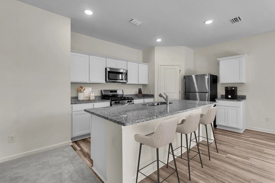 Representative furnished interior of a home built from the Supernova by Starlight Homes in Liberte, Converse (Image 2).