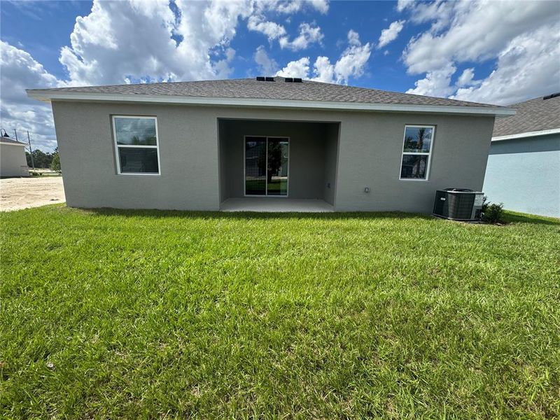 Exterior details and patio area of a home in Trinity Gardens, Deland (Image 3).