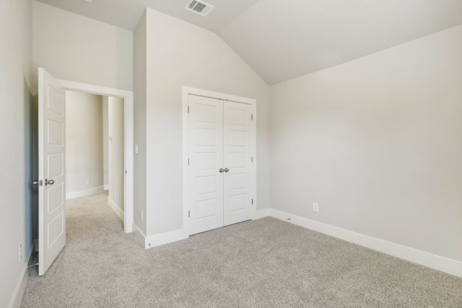 Guest bedroom in the Cedar floorplan at a Meritage Homes community.