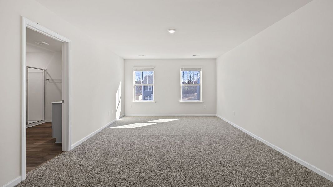 Spacious, unfurnished interior of a new home in Bentley Park, Greenwood (Image 29).