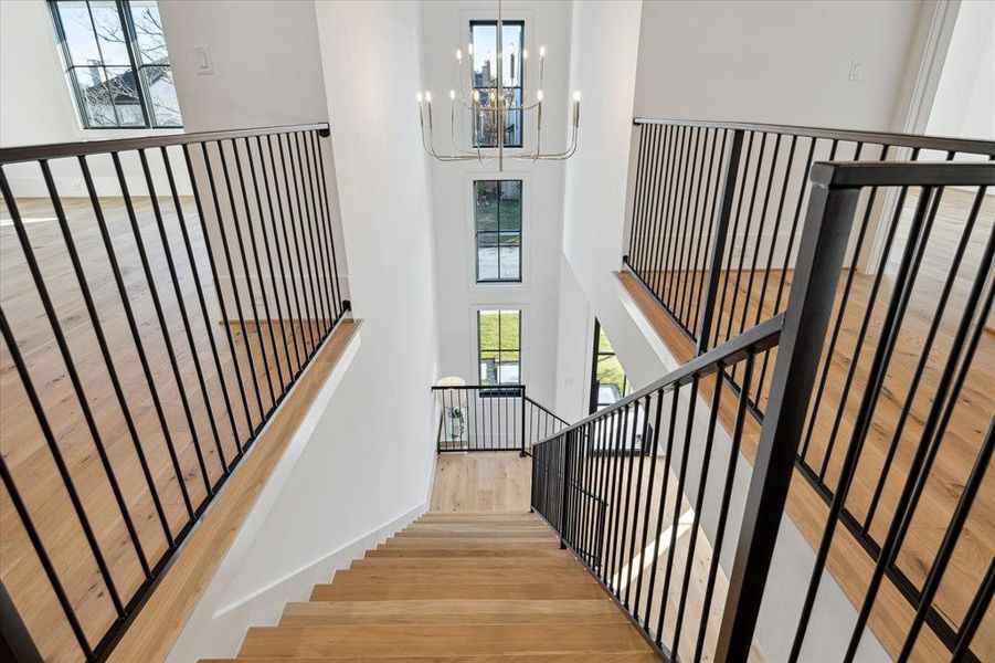 The strategic placement by the stairways adds a touch of architectural charm, creating a seamless transition between levels while offering a vantage point for both residents and guests to admire the home's interior beauty