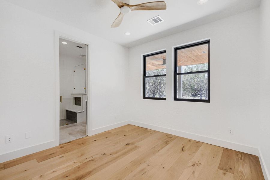 Spare room featuring light wood finished floors, a ceiling fan, and recessed lighting Spare room featuring light wood finished floors, a ceiling fan, and recessed lighting
