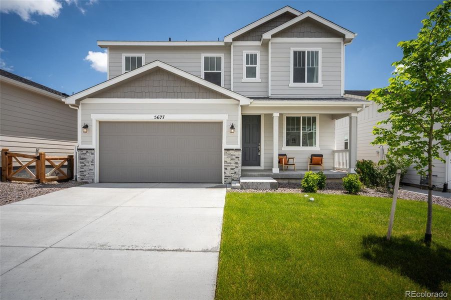 Front exterior of a new home in , Colorado Springs, CO, highlighting curb appeal (Image 19).