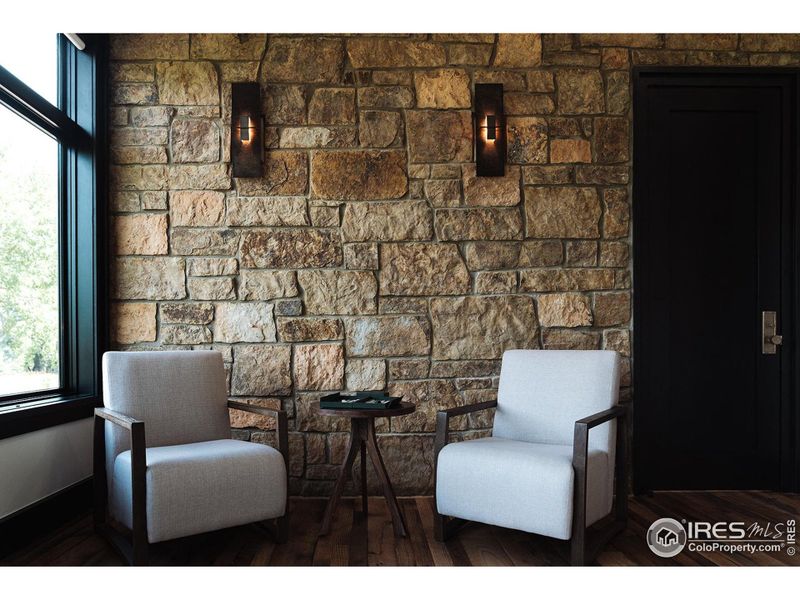 Primary Bedroom sitting area with double sided fireplace