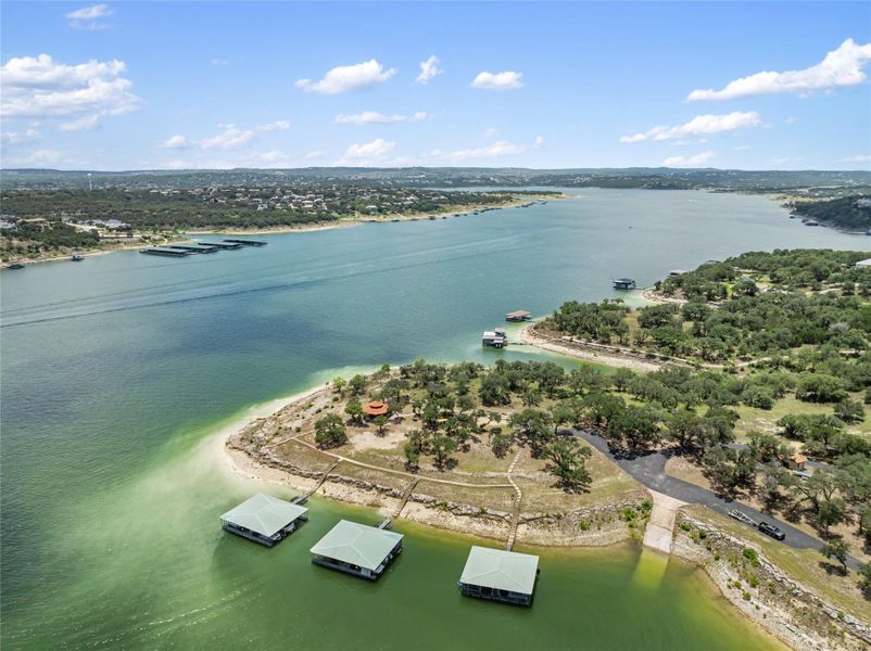 A sprawling waterfront estate awaits, boasting private boat slips and a scenic landscape. A sprawling waterfront estate awaits, boasting private boat slips and a scenic landscape.