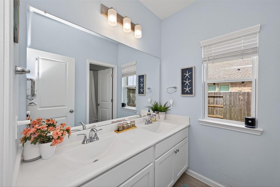 Spacious bathroom vanity area with dual sinks and generous counter space