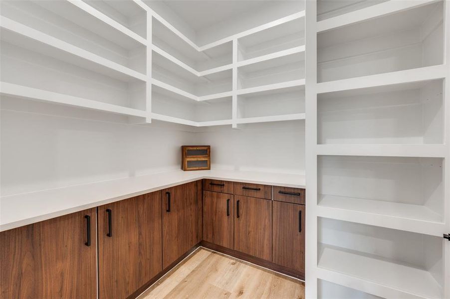 Built-in custom shelving and cabinetry offering extensive storage