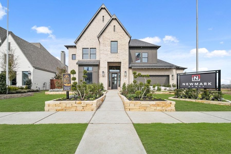 Front exterior of a new home in Meridiana 40', 65', Manvel, TX, highlighting curb appeal (Image 1). Front exterior of a new home in Meridiana 40', 65', Manvel, TX, highlighting curb appeal (Image 1).
