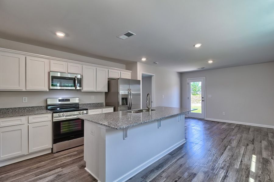Representative furnished interior of a home built from the Juniper by McGuinn Homes in Hunters Branch, Hopkins (Image 3).