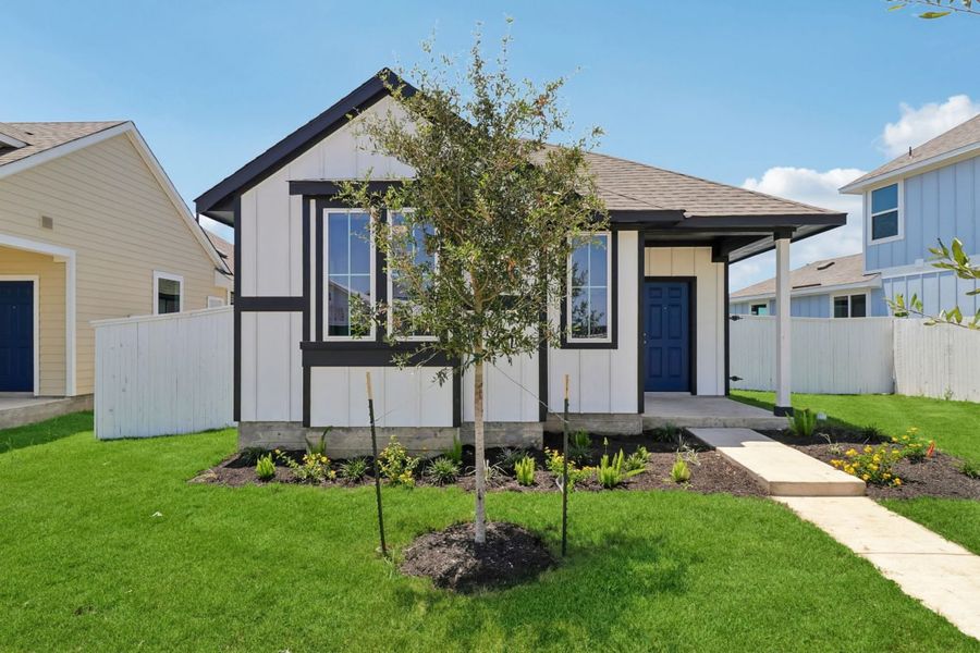 Front exterior of a new home in Harvest Ridge, Elgin, TX, highlighting curb appeal (Image 2). Front exterior of a new home in Harvest Ridge, Elgin, TX, highlighting curb appeal (Image 2).