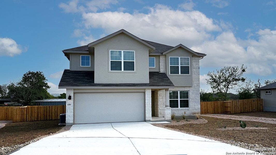 Front exterior of a new home in High Garden, Comfort, TX, highlighting curb appeal (Image 1).